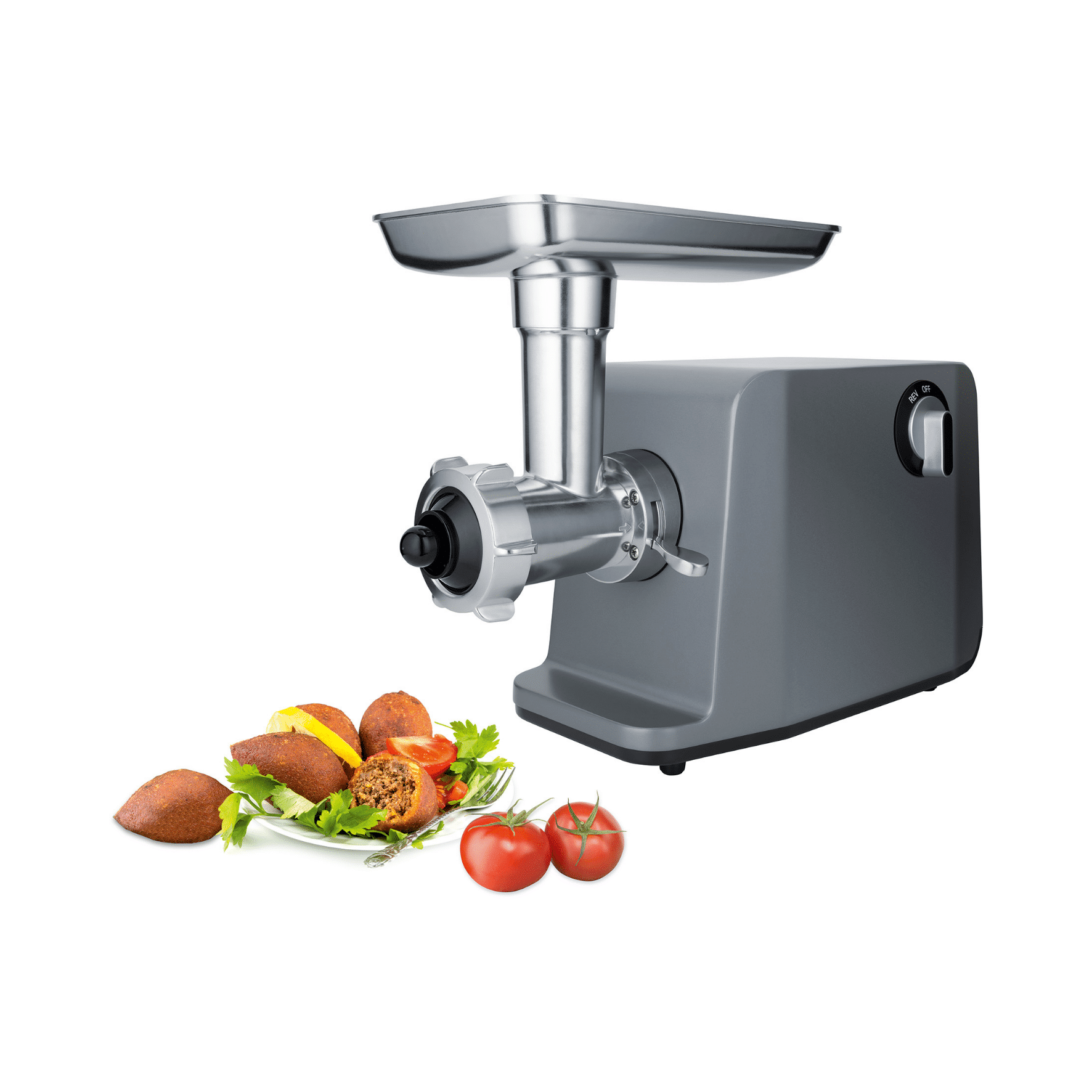 Elektro-Fleischwolf Steba MG 3000 Pro mit Edelstahl-Gehäuse, inkl. Zubehör und frischen Zutaten wie Tomaten und gefüllten Teigtaschen.