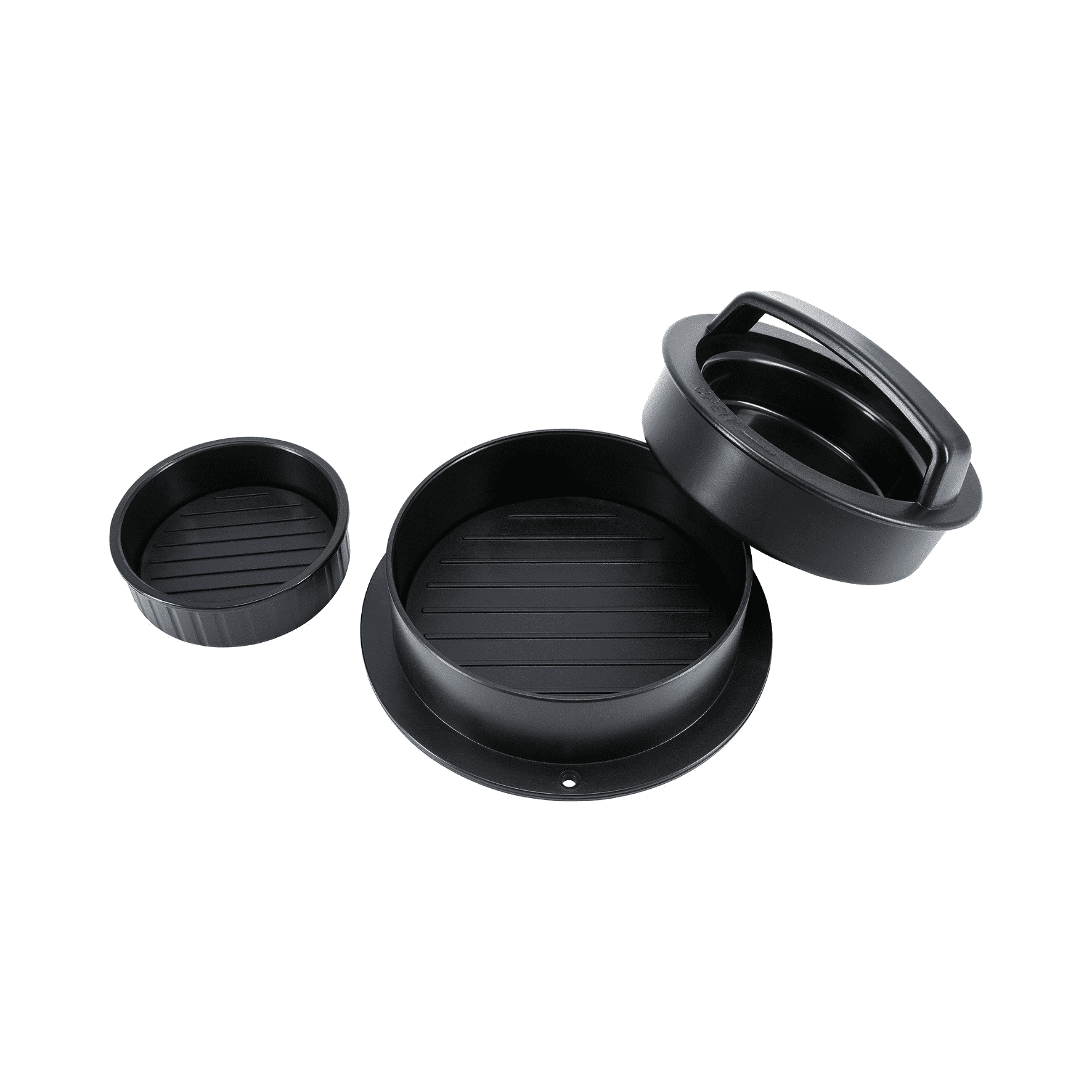 Drei Teile der Steba Burgerpresse: zwei runde Pressformen und ein Deckel, alle in Schwarz mit rutschfester Oberfläche.